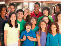 A girl holding a sign that says racism is also a pandemic.