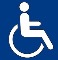 A girl holding a sign that says racism is also a pandemic.