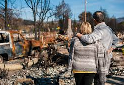 A girl holding a sign that says racism is also a pandemic.