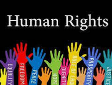 A girl holding a sign that says racism is also a pandemic.