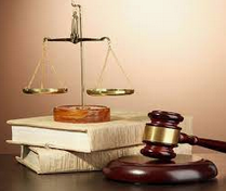 A girl holding a sign that says racism is also a pandemic.