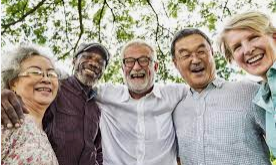 A girl holding a sign that says racism is also a pandemic.
