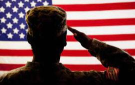 A girl holding a sign that says racism is also a pandemic.